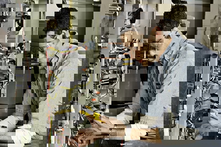 tech working on unit